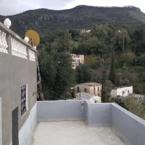 a balcony of a building with a view of a mountain at دوار المروج بوعادل تاونات in Taounate