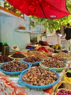 a table with many plates of food on it at دوار المروج بوعادل تاونات in Taounate