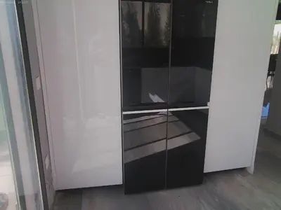 a black and white cabinet with glass doors at Villa GHMAT in Aghmat