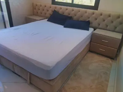 a bed in a bedroom with a large mattress at Villa GHMAT in Aghmat
