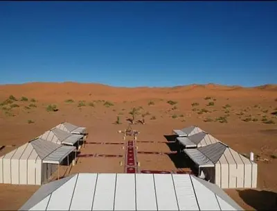 a group of buildings in the middle of a desert at Starlight Mirage Camp in Lac Yasmins