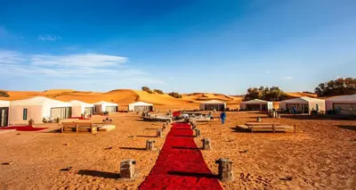 a red carpet in the middle of a desert at Starlight Mirage Camp in Lac Yasmins