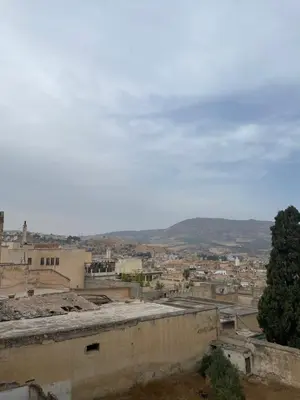 a view of a city from the roof of a building at Chambre à deux lit in Fès