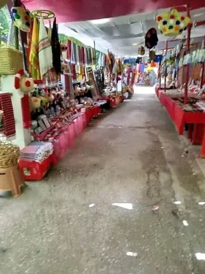 an aisle of a market with a lot of merchandise at Bouadel taounate in Fès