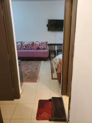 a view of a living room with a purple couch at le bon coin in Ifrane