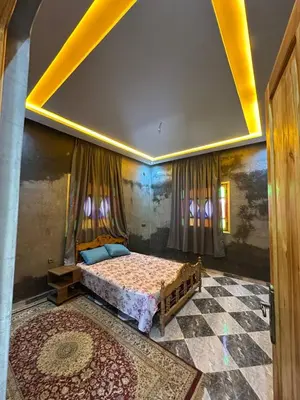 a bedroom with a bed in a room at Villa Zine in Aït Namous