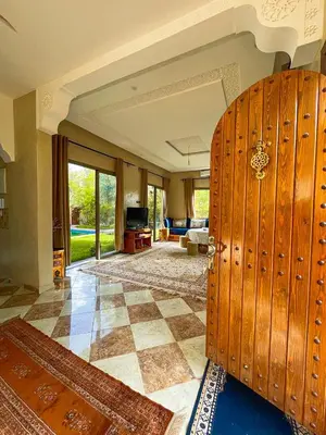 a living room with a large room with a checkerboard floor at Villa à ourika, piscine et montagnes, 40 min Marrakech in Ourika