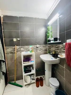 a bathroom with a sink and a toilet at Appartement lux meublé in Ouarzazate