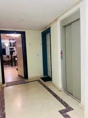 an empty hallway with two doors in a room at Appartement lux meublé in Ouarzazate