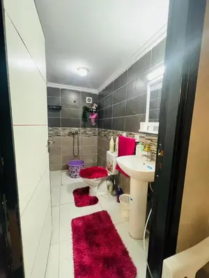 a bathroom with a sink and a toilet and a shower at Appartement lux meublé in Ouarzazate