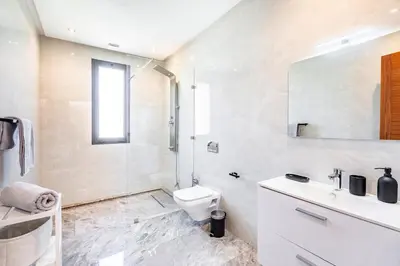 a bathroom with a toilet and a shower and a sink at Villa Maryam , Élégance et calme & piscine privée in Marrakech