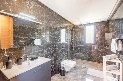 a bathroom with a sink and a toilet at Villa Maryam , Élégance et calme & piscine privée in Marrakech