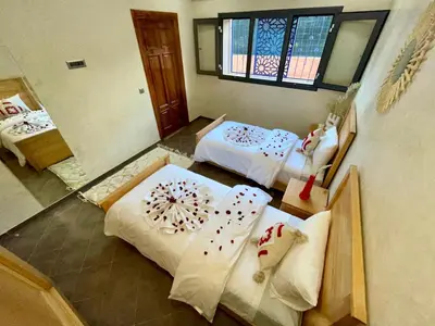an aerial view of a room with two beds at Shams 2 in Sbiti