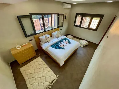an overhead view of a bedroom with a bed and windows at Shams 2 in Sbiti