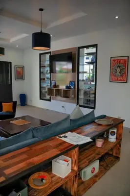 a living room with a couch and a table at Maison blanche in Sbiti