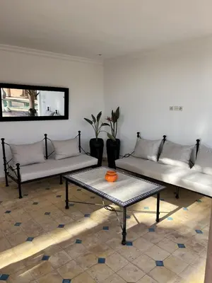 a living room with two couches and a table at Villa 4 chambres avec grande piscine privée in Marrakech