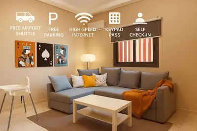 a living room with a couch and a table at Relax Family 05 - Cozy Entire Apartment in City Center in Ouarzazate