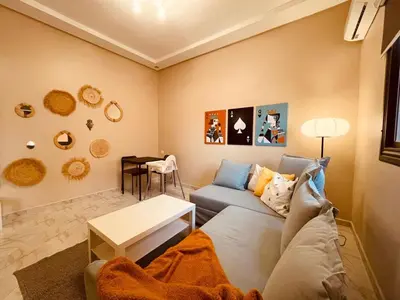 a living room with a couch and a table at Relax Family 05 - Cozy Entire Apartment in City Center in Ouarzazate