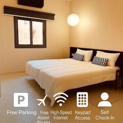 a bedroom with a large bed in a room at Relax Family 04 - Cozy Entire Apartment in City Center in Ouarzazate