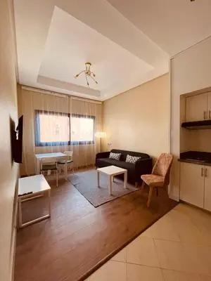 a living room with a couch and a table at Relax Family 04 - Cozy Entire Apartment in City Center in Ouarzazate