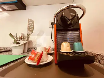 a kitchen counter with a coffee maker on a counter top at Relax Family 04 - Cozy Entire Apartment in City Center in Ouarzazate