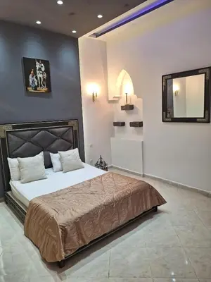 a bedroom with a bed and a mirror on the wall at Eden Suites
