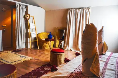 a cat is sitting on a bed in a room at Aisha VIP Camp in Merzouga