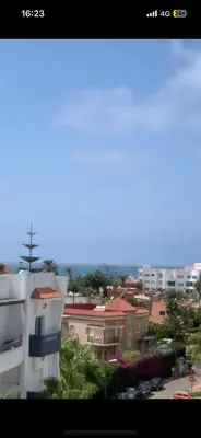 a view of a city with buildings and cars at residence le litoral 1 in Oulad Akkou