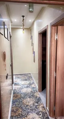 an empty room with a hallway with a rug at Appartement exceptionnel a louer in Oulad Akkou