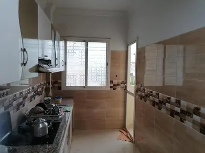 a kitchen with a sink and a counter top at Aicha's appartement 1 in Meknès