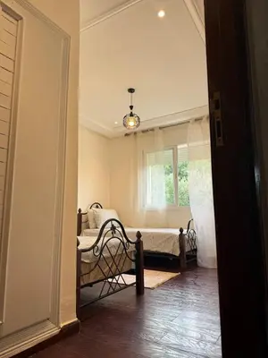a room with a bed and a window at Dar Dina Havre de paix sous les cèdres d'Ifrane in Ifrane