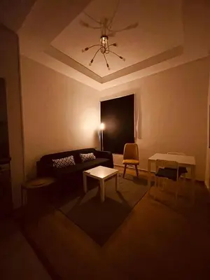 a living room with a couch and a table at Relax Family 01 - Cozy Entire Apartement in City Center in Ouarzazate