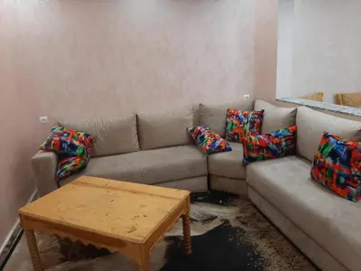 a living room with a couch and a coffee table at Chokri lamia in Ouled Khellouf