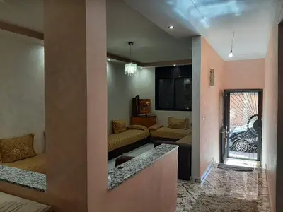 a living room with a couch and a window at Chokri lamia in Ouled Khellouf