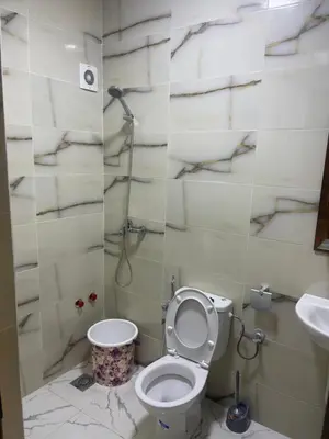 a bathroom with a toilet and a sink at AMB appartements in Oulad Akkou