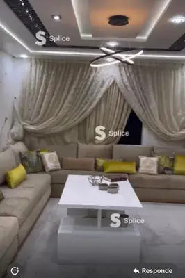 a living room with a couch and a table at Paysage del Costa in Oulad Akkou
