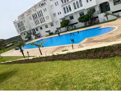 a large swimming pool in front of a building at Paysage del Costa in Oulad Akkou