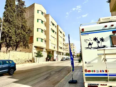 a truck parked on the side of a street at Residence Nasr Fes - Family & Traveler Apartments in Fès
