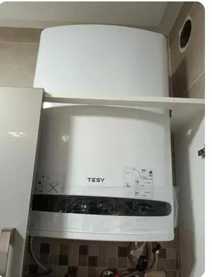 a white stove top oven in a kitchen at Appartement martil in Oulad Akkou