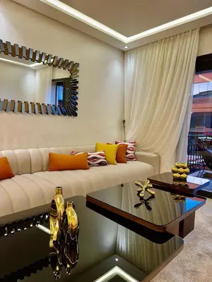 a living room with a couch and a table at Le Scandinave de Marrakech-Gueliz-Centre in Oulad Akkou