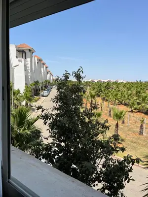 a view from a window of a street at Assilah in Oulad Akkou