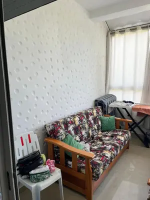 a living room with a couch and a table at Assilah in Oulad Akkou