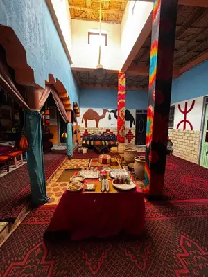 a large room with a table with food on it at Hostel Khamlia in Khamliya