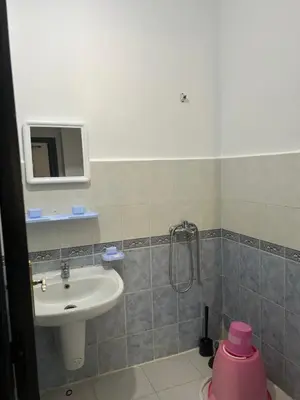 a bathroom with a sink and a shower at Social appartement at Martil in Oulad Akkou