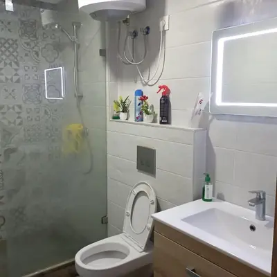 a bathroom with a shower and a toilet and a sink at Vacation apartment in Oulad Akkou