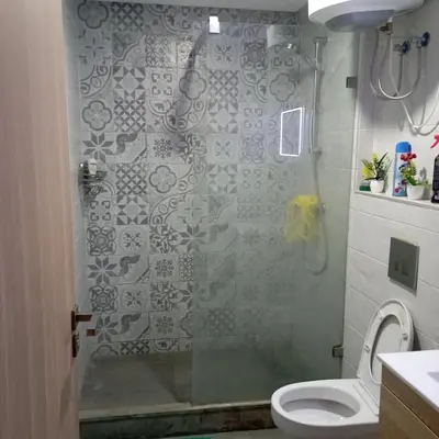 a bathroom with a shower and a toilet at Vacation apartment in Oulad Akkou
