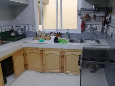 a kitchen with a sink and a counter top at appartement meuble in Oulad Akkou