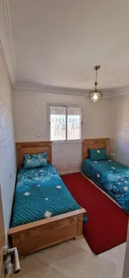 a bedroom with two beds in a room at Bahia Sakan in Oulad Akkou