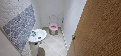 a small bathroom with a sink and a toilet at Bahia Sakan in Oulad Akkou