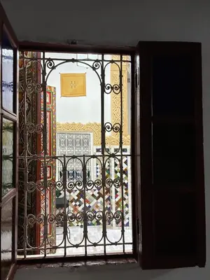 an open door with a view of a balcony at Riad Serendipity in Fès